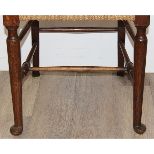 86 - A pair of Arts & Crafts period oak and seagrass seated chairs in the manner of William Morris, each ... 