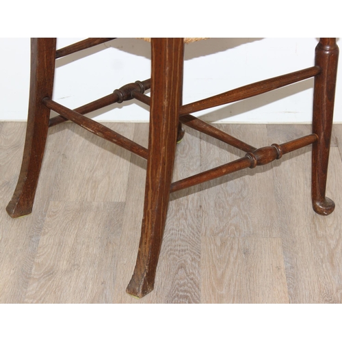 86 - A pair of Arts & Crafts period oak and seagrass seated chairs in the manner of William Morris, each ... 