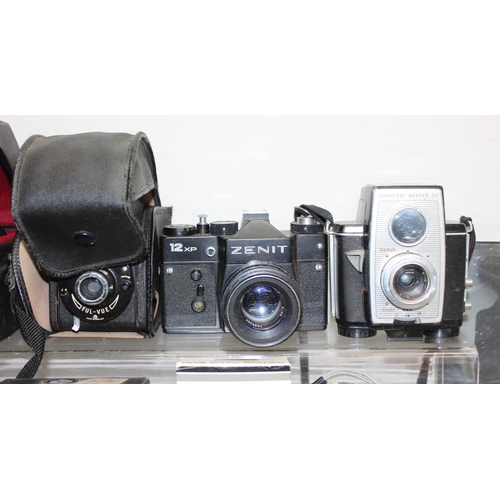 710 - 2 boxes of assorted cameras, parts and accessories, to inc Zenit 12XP, Minolta 5000, Praktica MTL 3 ... 