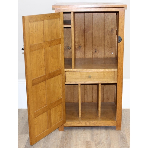 56 - In the manner of Robert 'Mouseman' Thompson of Kilburn, a superb quality panelled oak side cupboard ... 