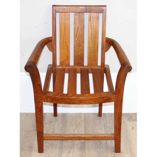 113 - A modern hardwood armchair, believed to be teak, approx 63cm W x 87cm H