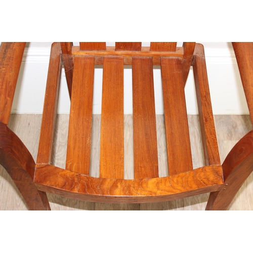 113 - A modern hardwood armchair, believed to be teak, approx 63cm W x 87cm H