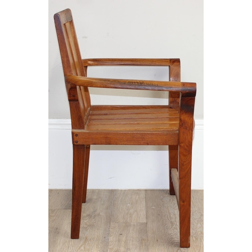 113 - A modern hardwood armchair, believed to be teak, approx 63cm W x 87cm H