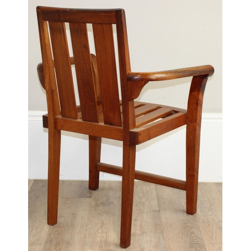 113 - A modern hardwood armchair, believed to be teak, approx 63cm W x 87cm H