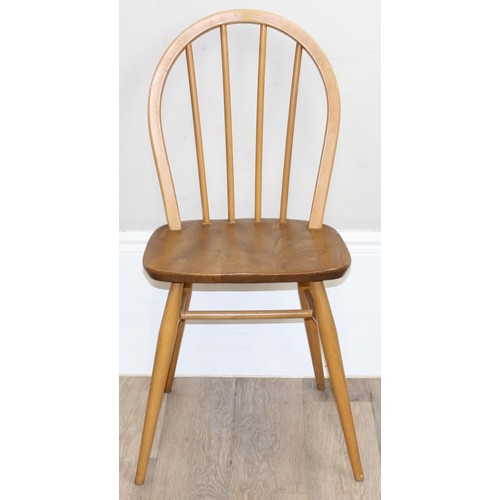 23 - A set of 4 Ercol hoop back dining chairs, blonde finish, model 400, each approx 87cm tall