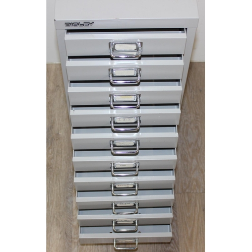 297 - A small light grey Bisley cabinet with 10 drawers, approx 28cm x 42cm x 68cm