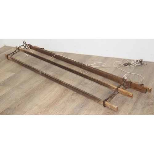 298 - A vintage wooden drying rack with cast iron fittings, approx 150cm long