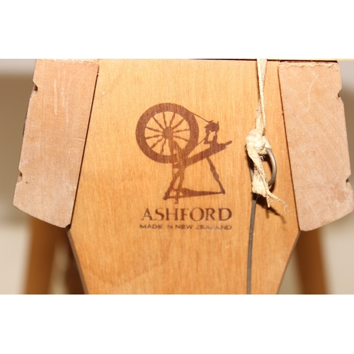 290 - Ashford of New Zealand spinning wheel, 3 spool reels on stand and an Empisal Knitmaster 305 knitting... 