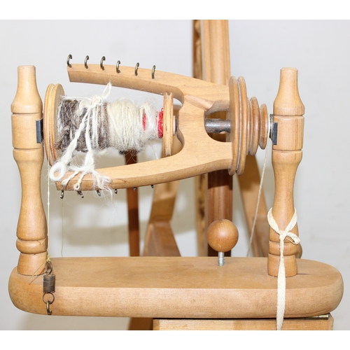 290 - Ashford of New Zealand spinning wheel, 3 spool reels on stand and an Empisal Knitmaster 305 knitting... 