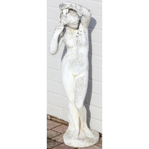 302 - A large vintage weathered reconstituted stone garden statue depicting a nude classical female, marke... 