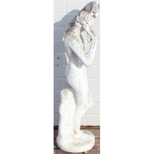 302 - A large vintage weathered reconstituted stone garden statue depicting a nude classical female, marke... 