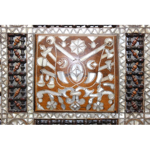 15 - Large Syrian mother of pearl inlaid wooden mirror, the intricately carved wood is inlaid with geomet... 