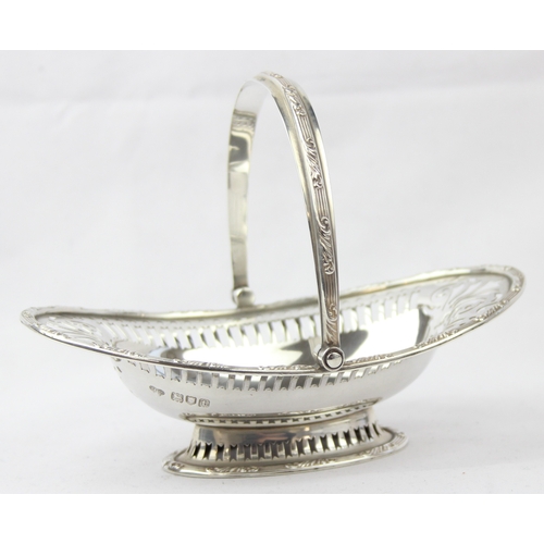 1017 - [164.02g] - an antique pierced swing handle basket, marked for London 1914 by Goldsmiths & Silversmi... 