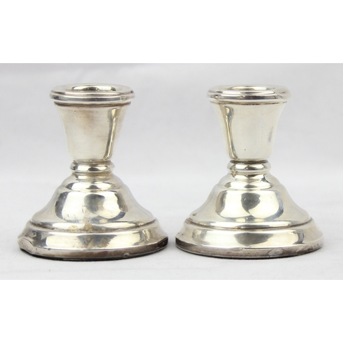 1099A - A pair of plain silver dwarf candlesticks, Birmingham 1973 by Sanders & Mackenzie, 6cm tall, 123.84g... 