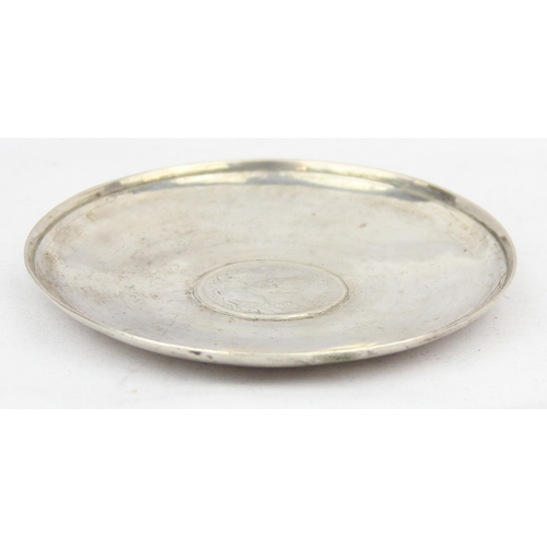 1099F - [55.87g] - an unmarked low grade silver dish set with an Iranian 5000 dinars silver coin, the dish X... 