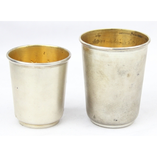 1099G - [70.44g] - 2 antique silver shot cups with gilt lined interiors and matte finish, both indistinctly ... 