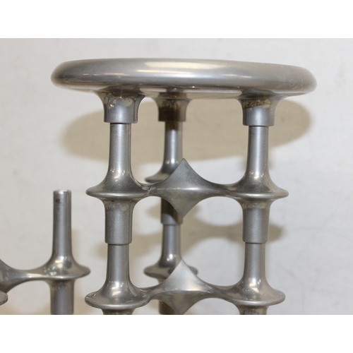 1018A - In the manner of Hans Nagel (German, 1926-1978) - a 15 piece modular metal stacking candlestick comp... 