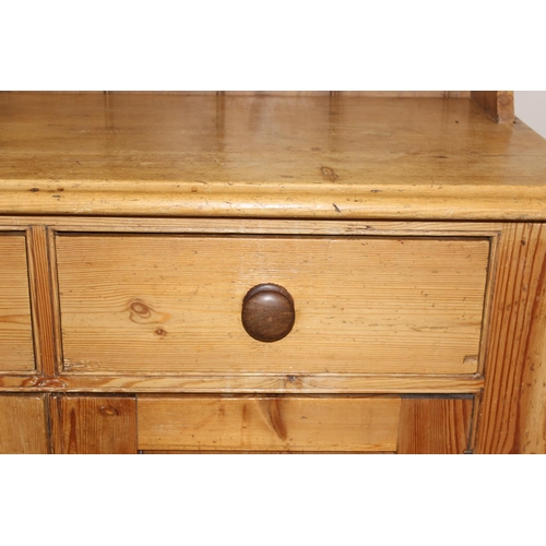 10 - A 19th century pine dresser with plate rack, 2 drawers over a cupboard, approx 109cm wide x 52cm dee... 