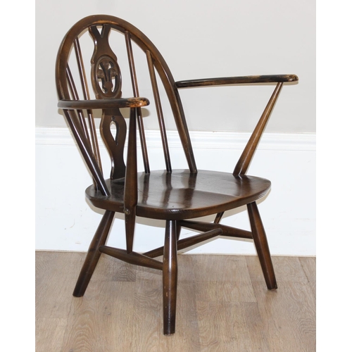 48 - An Ercol fleur-de-lys armchair, a retro magazine rack and an antique rosewood jewellery box, the cha... 