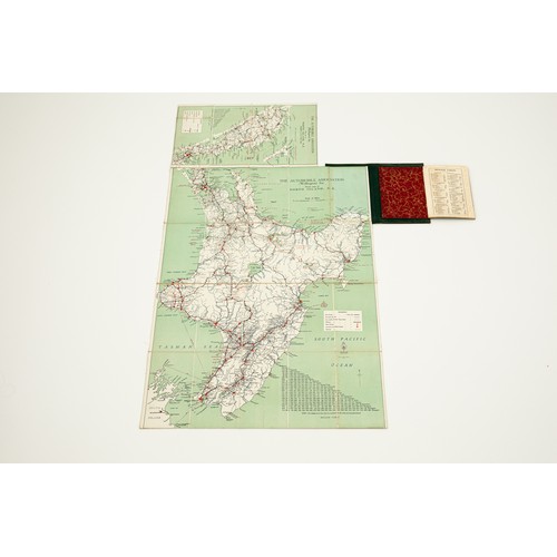 18 - A vintage leather bound New Zealand road map set showing both the North & South Islands, the gilt to... 