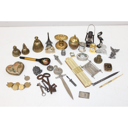 A tin of assorted interesting small curios and collectables