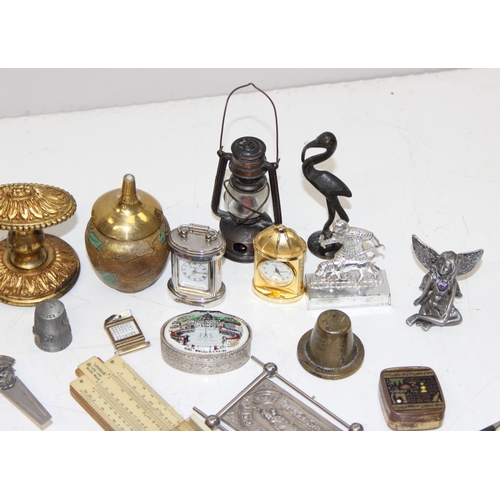 A tin of assorted interesting small curios and collectables