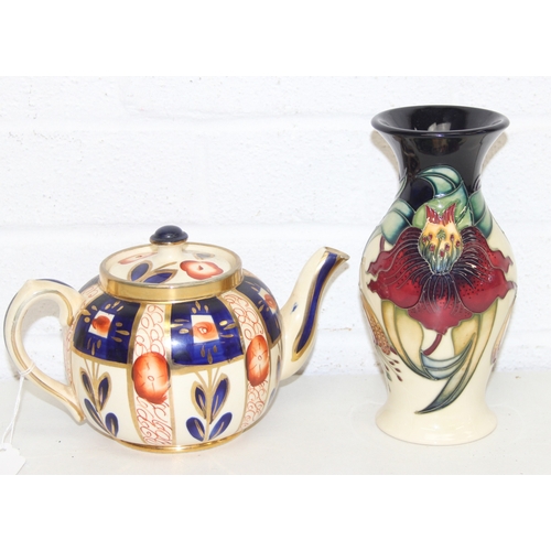 1458 - A Moorcroft pottery vase of baluster form, Anna Lily pattern, late 20th century, marks to base, and ... 