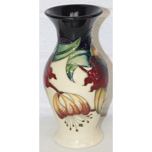 1458 - A Moorcroft pottery vase of baluster form, Anna Lily pattern, late 20th century, marks to base, and ... 