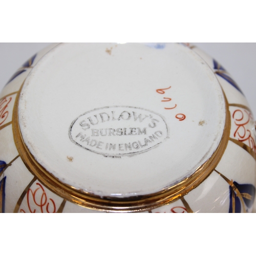 1458 - A Moorcroft pottery vase of baluster form, Anna Lily pattern, late 20th century, marks to base, and ... 