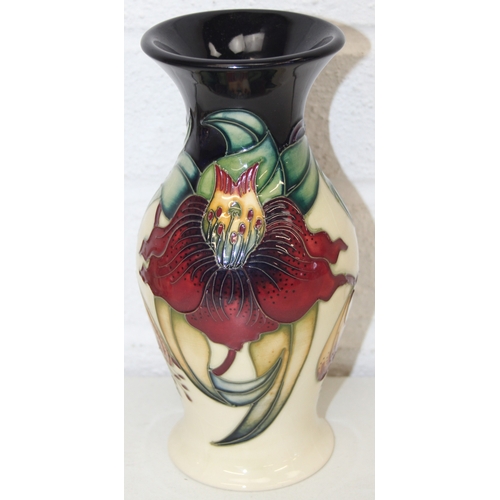 1458 - A Moorcroft pottery vase of baluster form, Anna Lily pattern, late 20th century, marks to base, and ... 