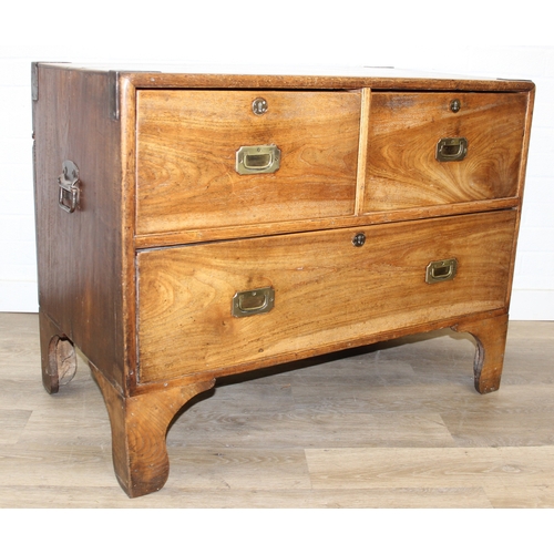 33 - An antique camphorwood two over one chest of drawers with recessed brass campaign handles and bracke... 