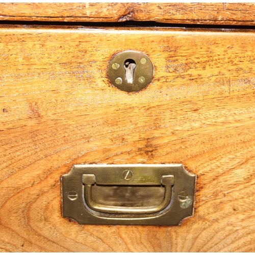 33 - An antique camphorwood two over one chest of drawers with recessed brass campaign handles and bracke... 