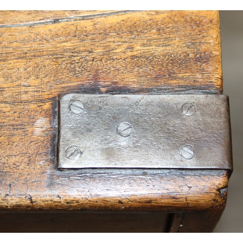 33 - An antique camphorwood two over one chest of drawers with recessed brass campaign handles and bracke... 