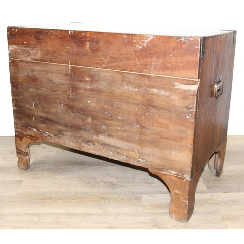 33 - An antique camphorwood two over one chest of drawers with recessed brass campaign handles and bracke... 