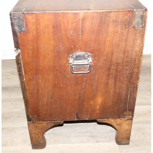 33 - An antique camphorwood two over one chest of drawers with recessed brass campaign handles and bracke... 