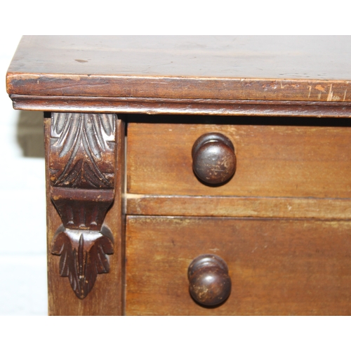 4 - An antique mahogany Wellington chest, seven drawers with turned handles and carved details to pillar... 