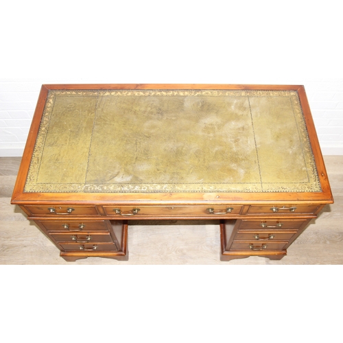 198 - An antique style three part pedestal desk with green inset leather top, 121cm x 60cm x 78cm