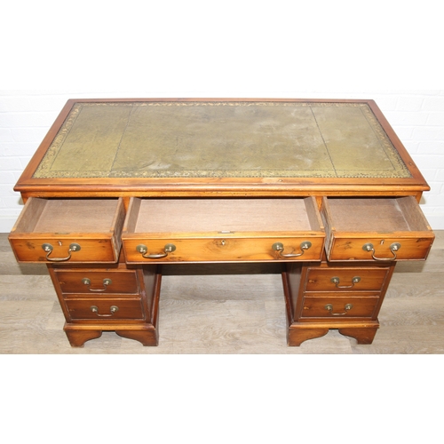 198 - An antique style three part pedestal desk with green inset leather top, 121cm x 60cm x 78cm