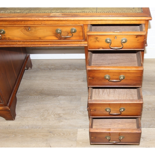 198 - An antique style three part pedestal desk with green inset leather top, 121cm x 60cm x 78cm