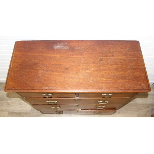 29 - An antique two over three mahogany chest of drawers with Secessionist Art Nouveau period brass handl... 