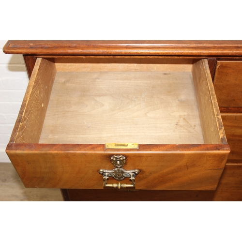 29 - An antique two over three mahogany chest of drawers with Secessionist Art Nouveau period brass handl... 