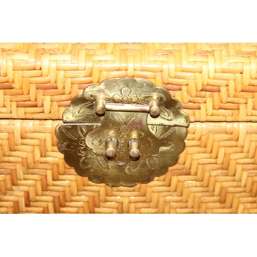 34 - A vintage wicker trunk with brass clasp, possibly Chinese, 80cm x 50cm x 52cm