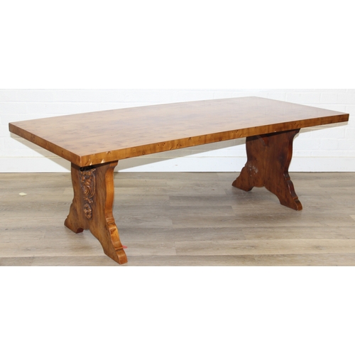 199C - A superb quality modern coffee table with yew wood finish, lion mask adornments to legs, 143cm x 69c... 
