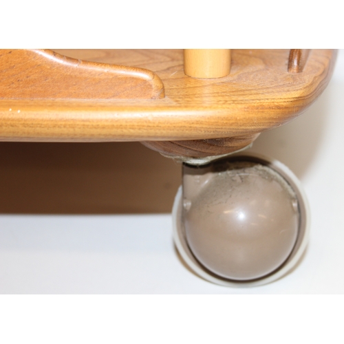 8 - Ercol - a retro 3-tiered Ercol Windsor trolley, blonde finish, approx 71cm wide x 47cm deep x 78cm t... 