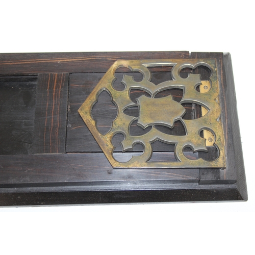 277 - An antique extending coromandel and brass book-slide with brass fretwork book-ends/holders, 41cm (56... 
