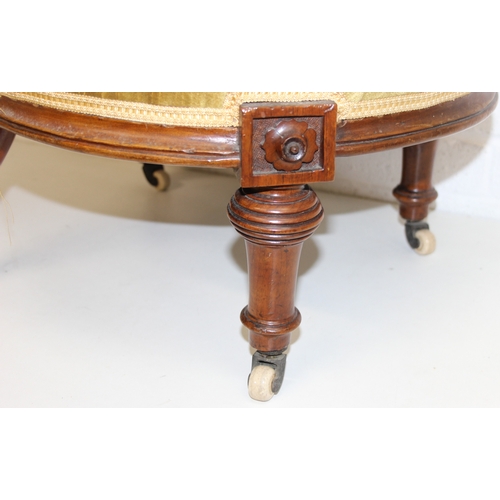 85 - A pair of decorative shield back armchairs with exposed carved frames and ceramic castors, 19th cent... 