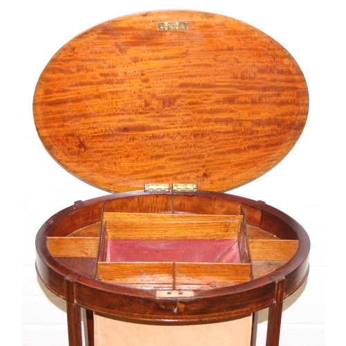 35 - An Edwardian mahogany sewing table of oval form, with lift up top and fabric basket, 49cm x 35cm x 7... 