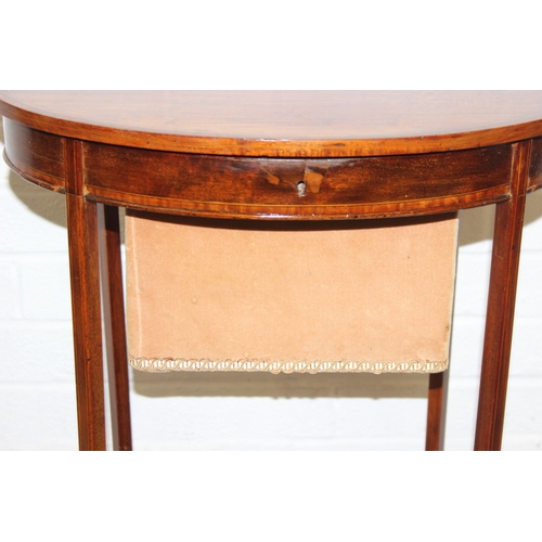 35 - An Edwardian mahogany sewing table of oval form, with lift up top and fabric basket, 49cm x 35cm x 7... 