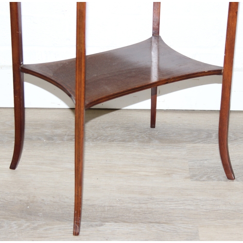 35 - An Edwardian mahogany sewing table of oval form, with lift up top and fabric basket, 49cm x 35cm x 7... 