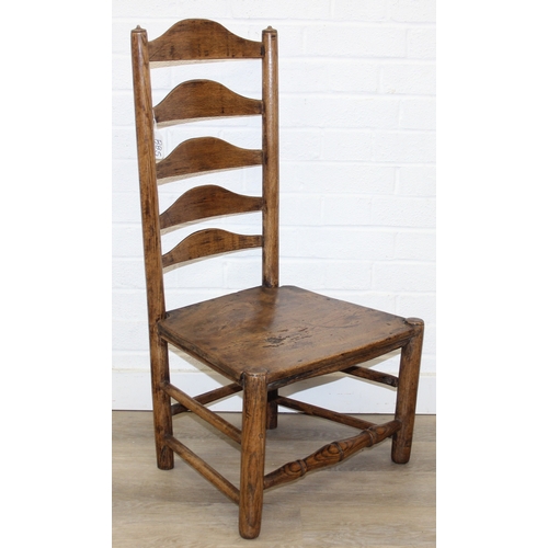81 - An antique ladder-back low chair with elm seat, 90cm tall, and an Arts & Crafts period side chair wi... 